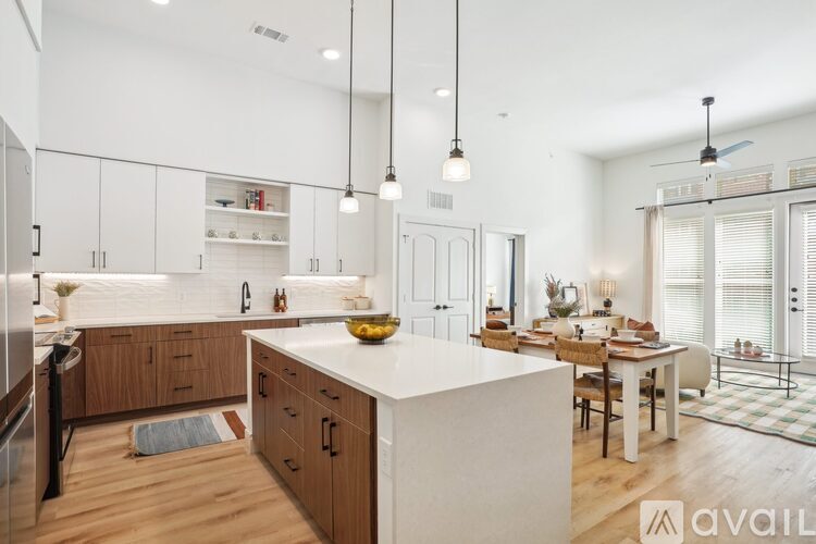 A modern kitchen with wooden cabinets and a white countertop.