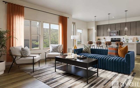 A modern living room with a blue sofa and a wooden coffee table.