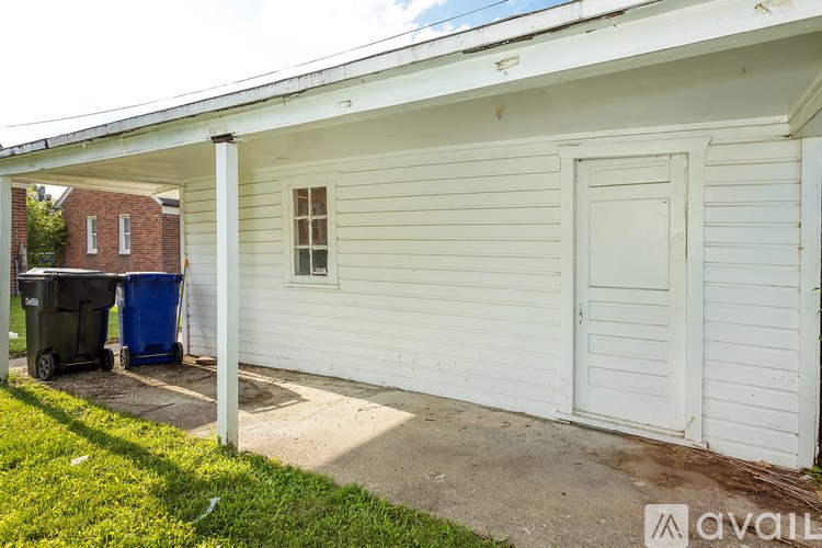 A white house with a closed door and a window.