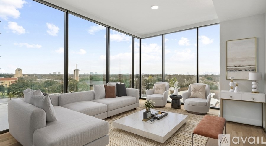 A living room with a large window overlooking a cityscape.