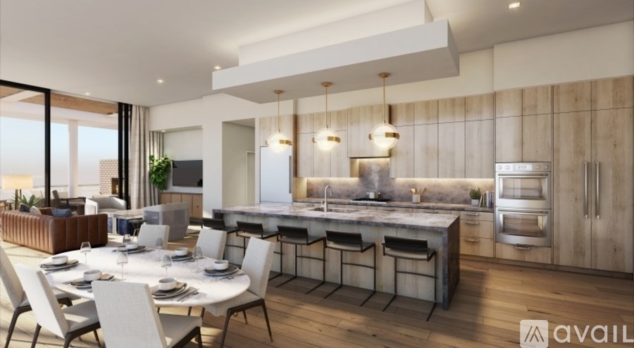 A modern kitchen with a dining table set for four.