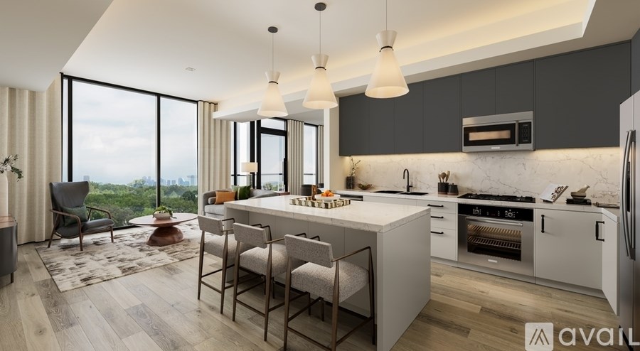 A modern kitchen with a dining table and chairs.