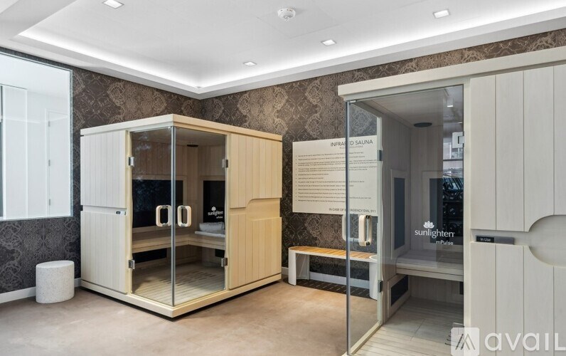 A room with a sunshineer booth and a bench.