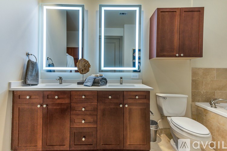 A bathroom with a sink, toilet, and bathtub.