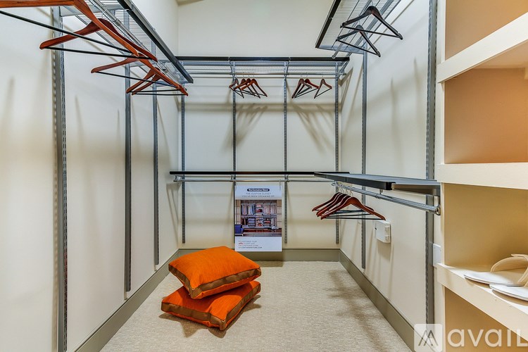 A room with a white wall and a poster on it.