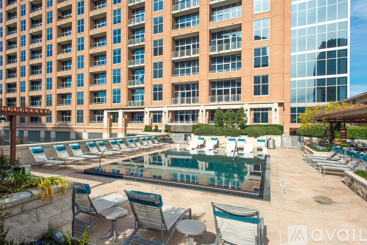 A large building with a pool in front.