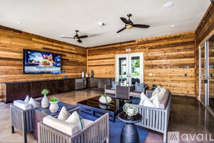 A living room with a television and a couch.