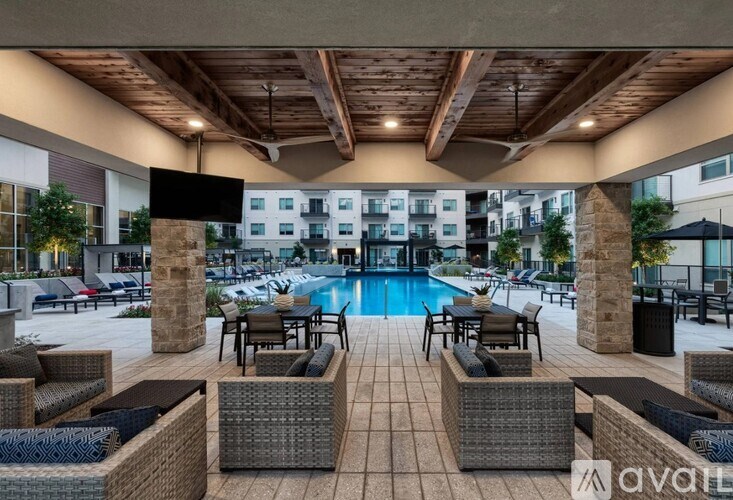 A patio with a pool and chairs is available for rent.