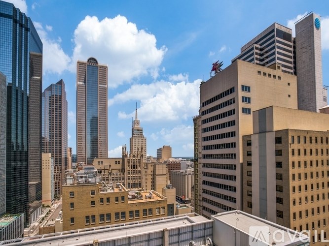 A cityscape with tall buildings and a clear sky.