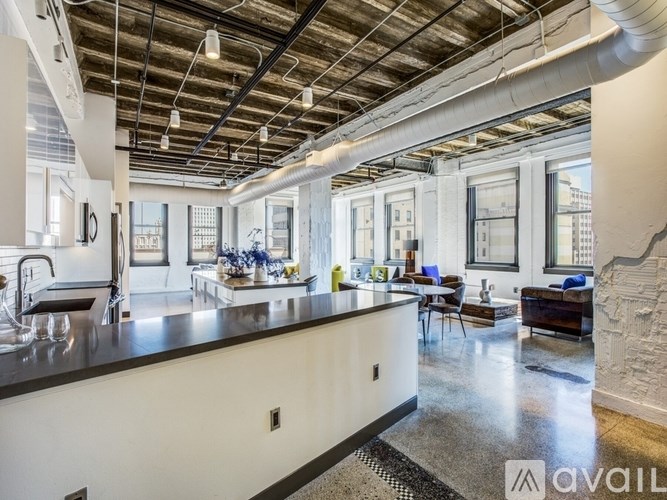 A modern kitchen with a large island and lots of counter space.