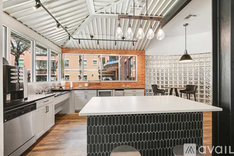 A modern kitchen with a large island in the center.