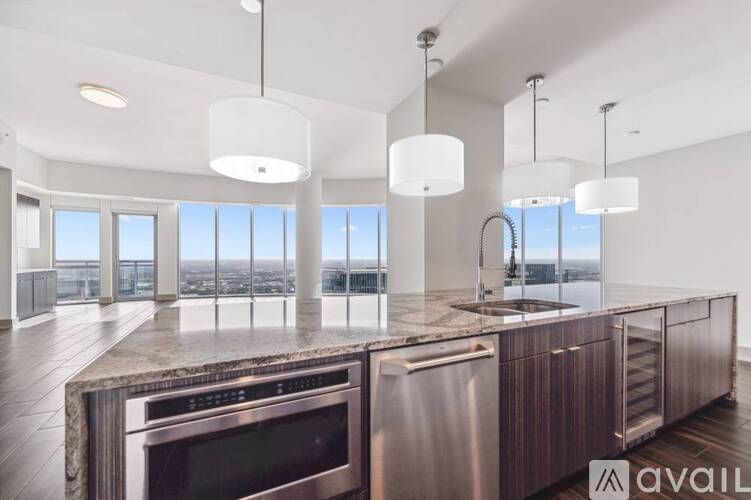A modern kitchen with a view of the city.