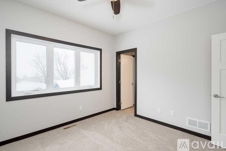 A room with a window and a door.