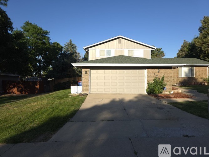 A house with a garage is for sale.