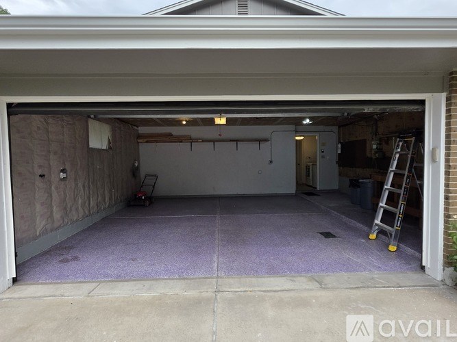 A house with a garage is available for sale.