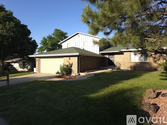 A house with a garage and a driveway.