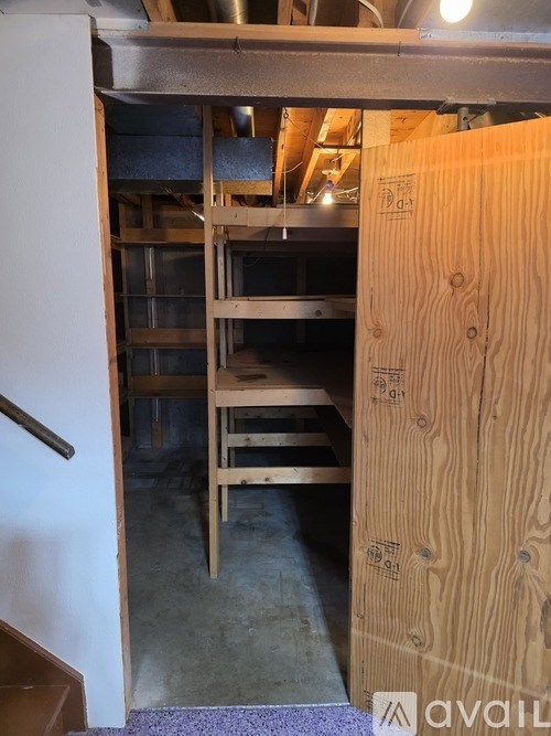 A white toilet sits in a bathroom with a glass shower door.