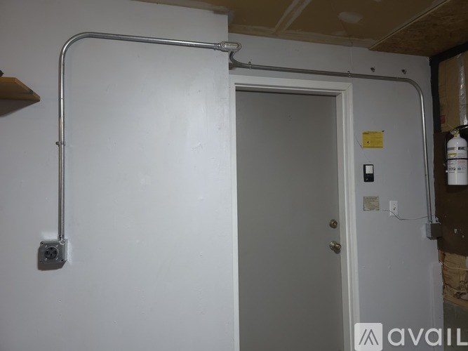 A bathroom with a toilet, sink, and shower.