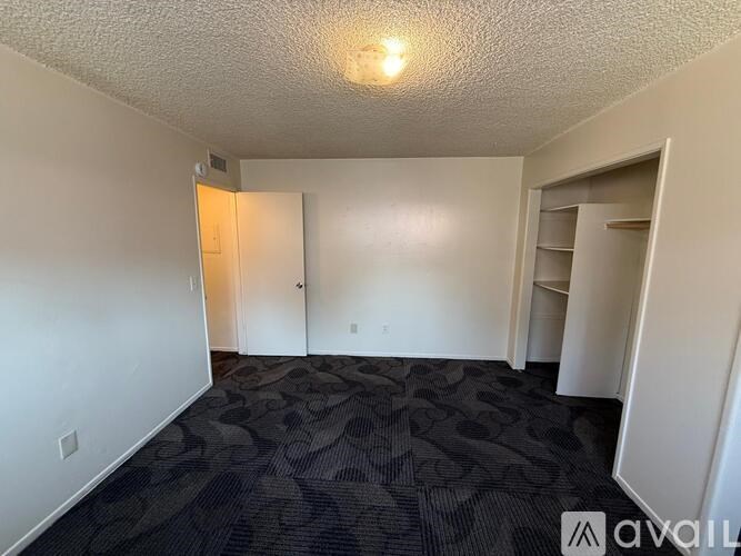 A kitchen area with a fan and a window.
