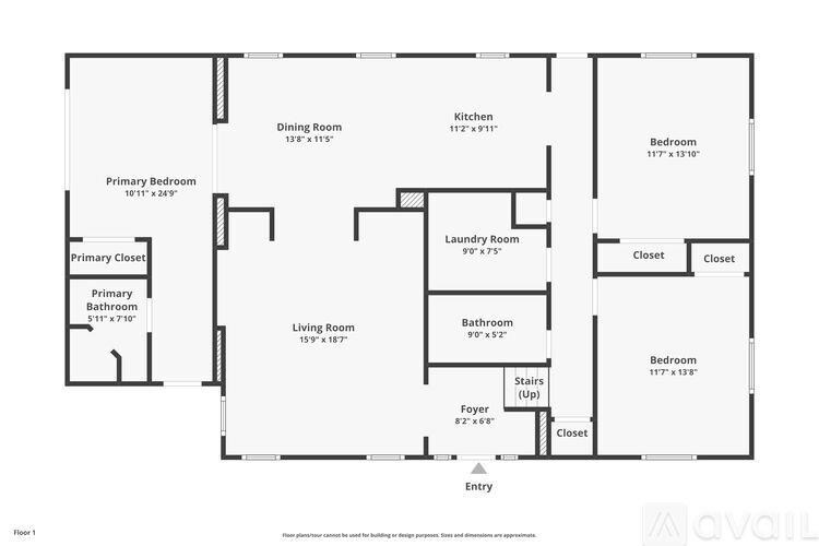 A living room with a beige couch, a coffee table, and a rug.