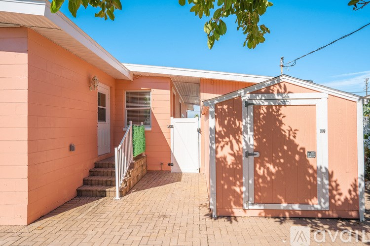 A house with a peach-colored exterior and a white door.
