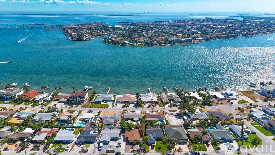 A coastal city with a bridge in the distance.