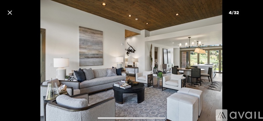 A living room with a grey sofa and a coffee table.