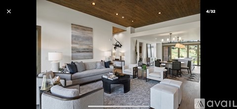 A living room with a grey sofa and a coffee table.