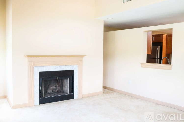A fireplace in a room with a window.