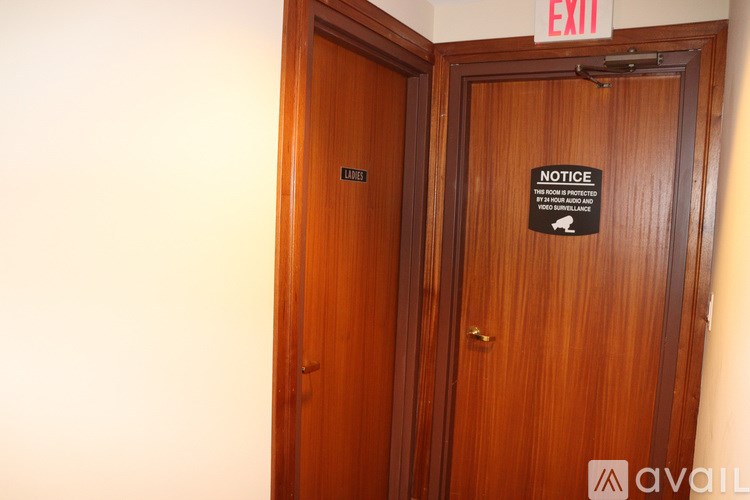 A wooden door with a notice sign on it.