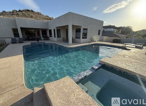 A modern house with a swimming pool in the backyard.