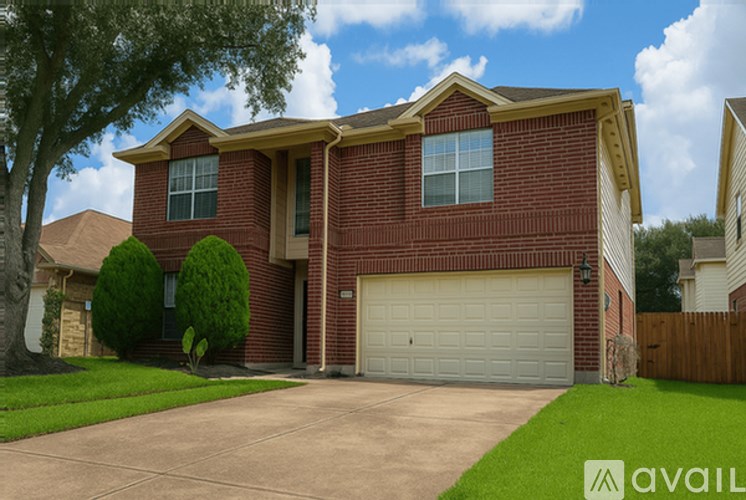 A house with a red brick exterior and a white garage door.