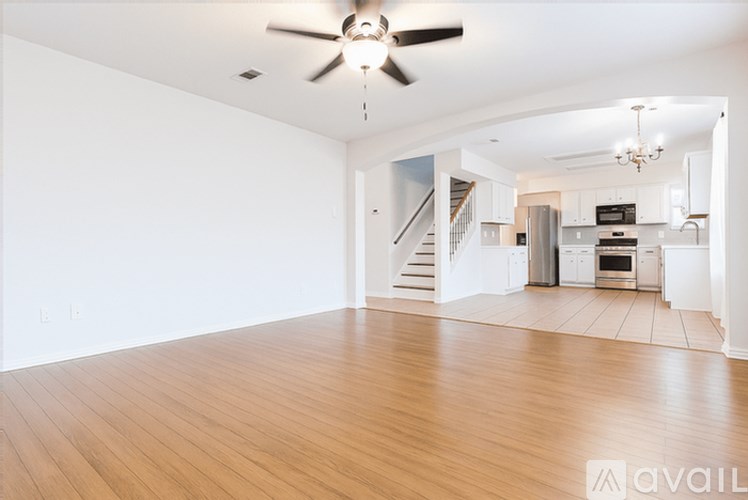A bathroom with a toilet, sink, and mirror.