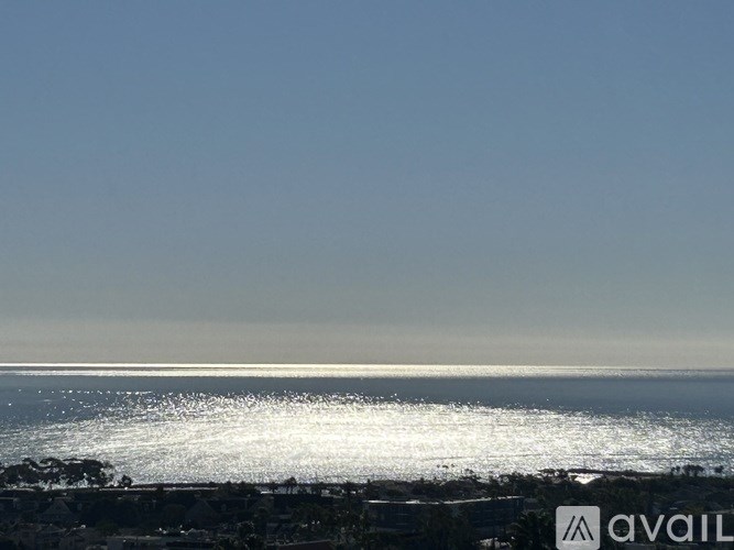 A beach scene with waves crashing onto the shore.