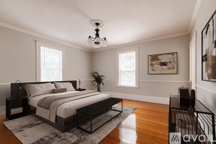 A room with a desk, chairs, and shelves.