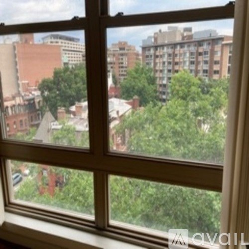 A view of a cityscape through a window.