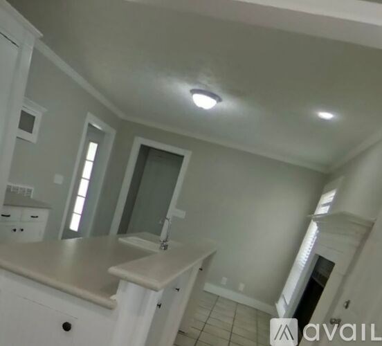 A bathroom with a sink and a mirror.