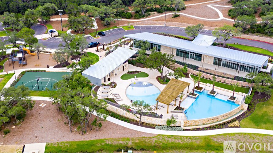 A large building with a pool and a basketball court.