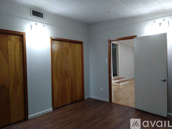A room with wooden doors and a white ceiling.