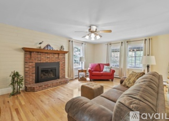 A living room with a fireplace and a couch.