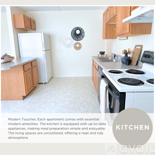 A kitchen with a white fridge, stove, and wooden cabinets.