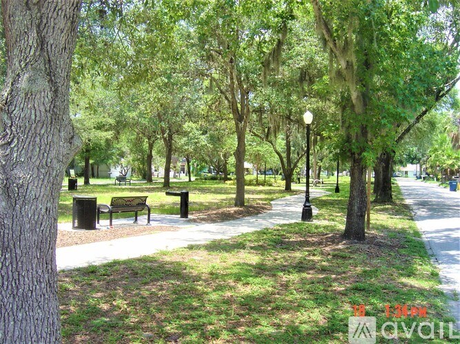 A park with trees and benches is shown.
