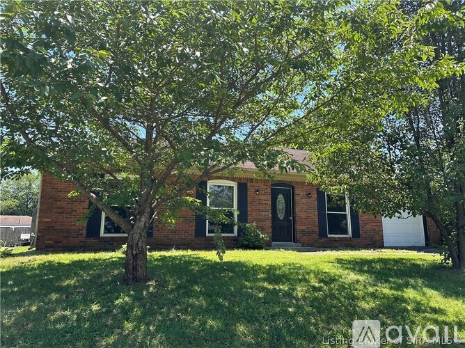 A house with a tree in front of it.