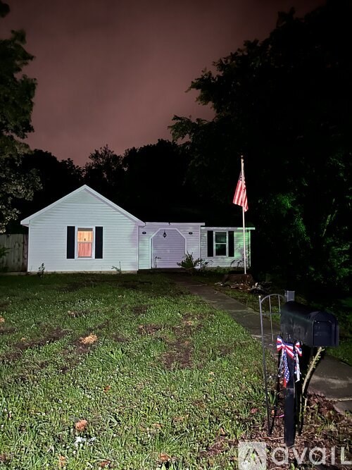 A small house with a flag on the front.