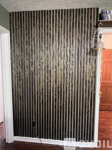 A wall with a lot of vertical lines on it.