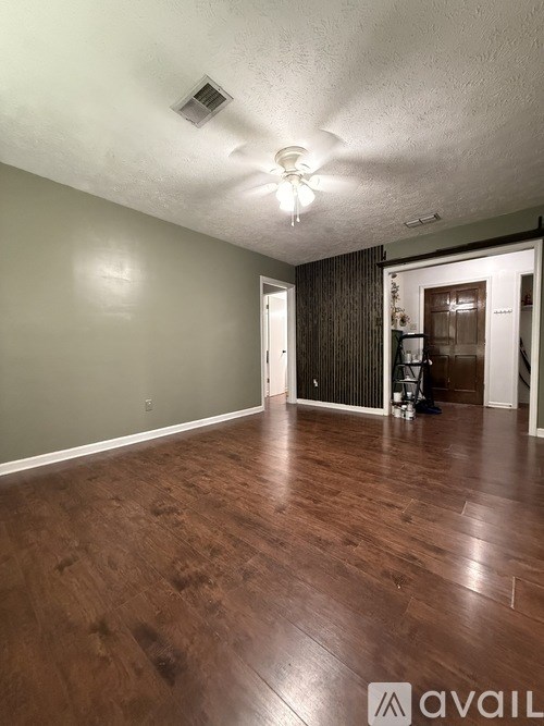 A stainless steel dishwasher is in a kitchen.