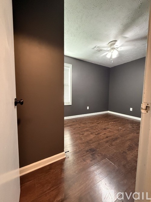 A room with a brown door and a white door.