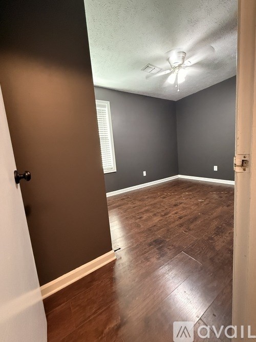 A room with a sliding door and a window.