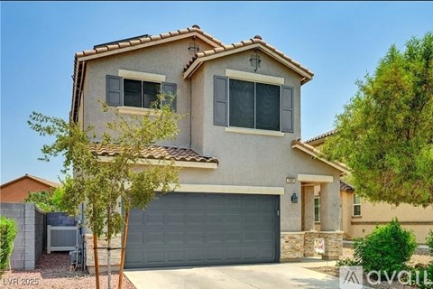 A two-story house with a garage is for sale.
