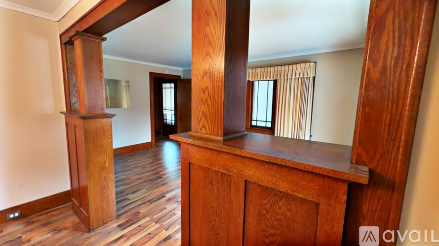 A kitchen with blue cabinets and a stone countertop.